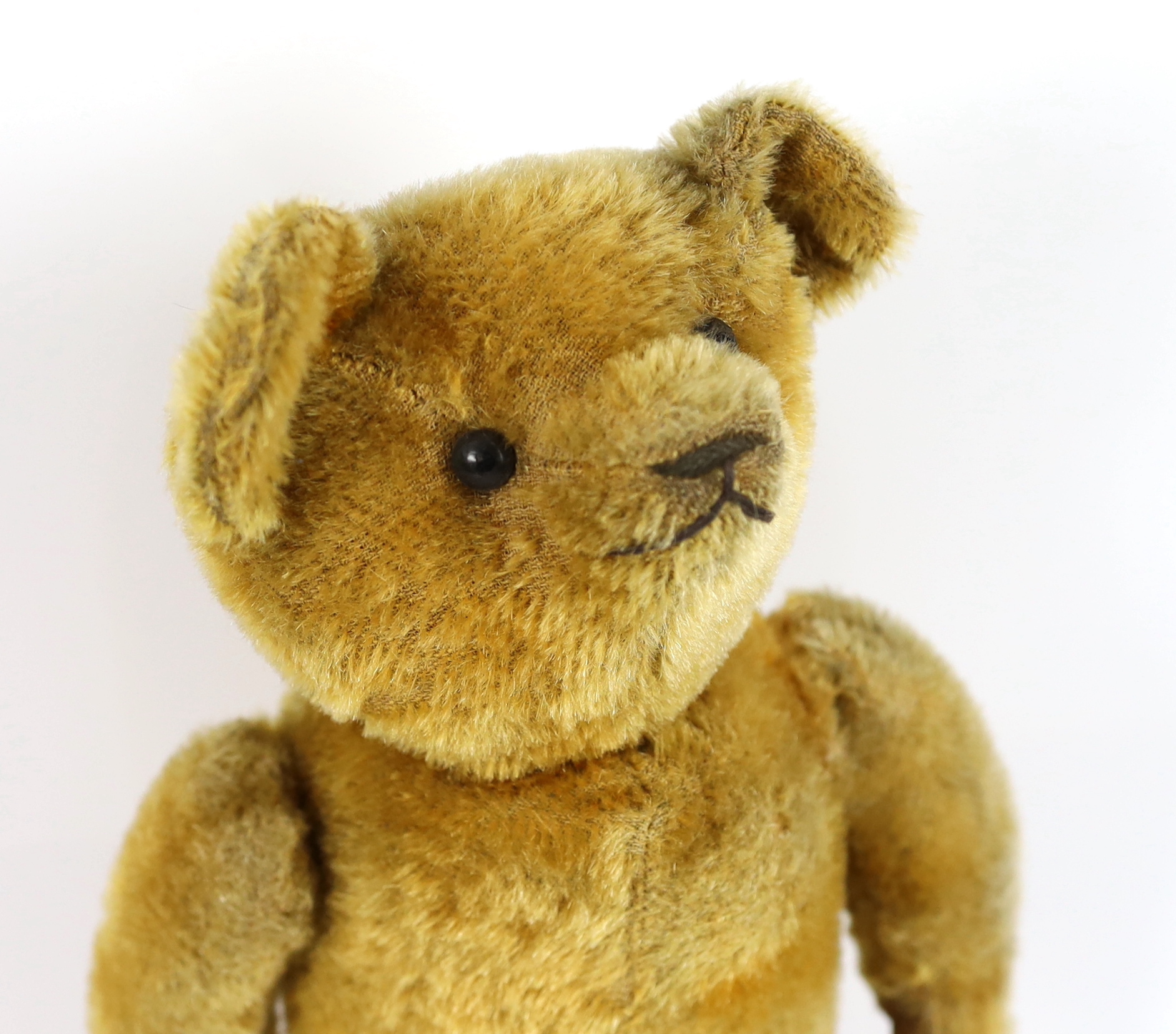 An early bear, possibly American c.1913, 40cm, in good condition, old repairs to paws